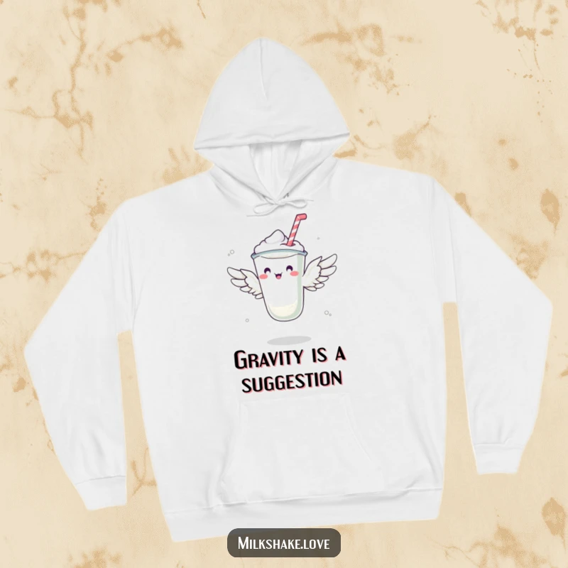 Funny hoodie with a milkshake sporting tiny wings, humorously attempting to achieve flight, a delightful and warm design.