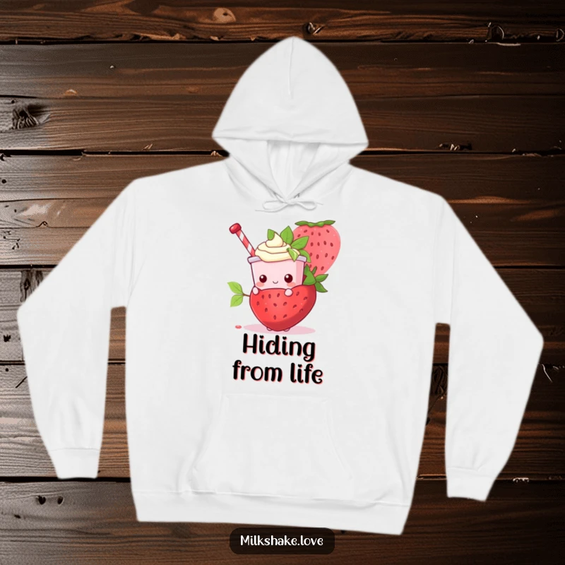 Funny Kawaii Milkshake character peeking out from behind a giant strawberry on a warm, cozy hoodie.