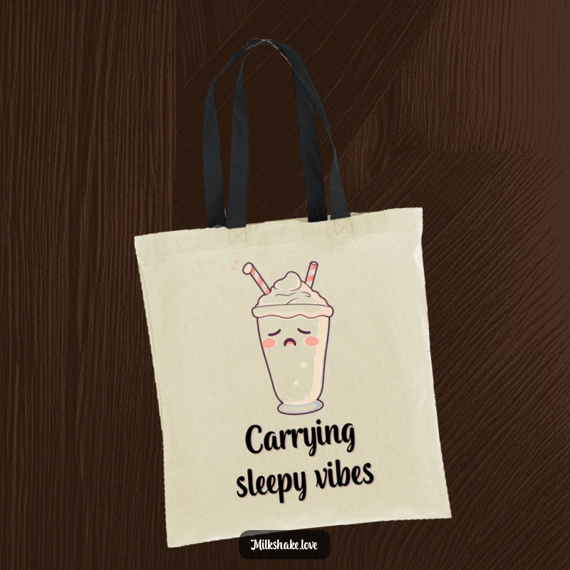 Funny tote bag with a sleepy milkshake character yawning, straw drooping, in a relatable state.